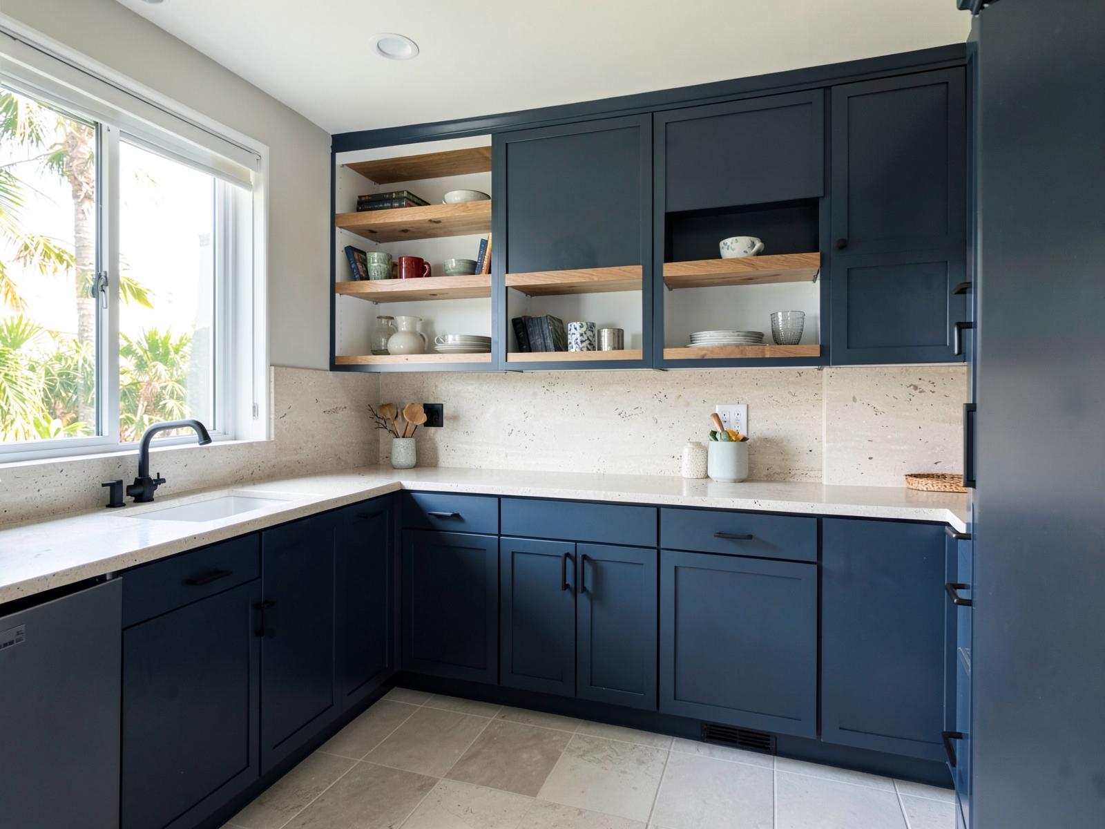River blue slab cabinets with oak open shelves